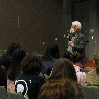 Man in front of students